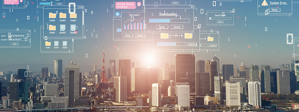 都心オフィスビル群を背景に企業間のデータ連携をイメージしたデータがやり取りされているイメージ写真